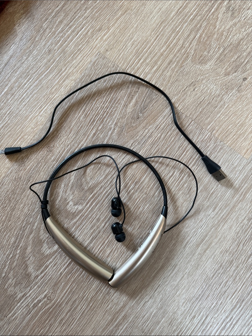 LG HBS750 Black and Tan Bluetooth neckband earphones